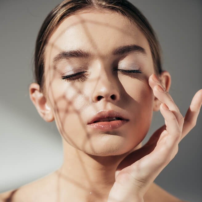 Skincare model applying facewash